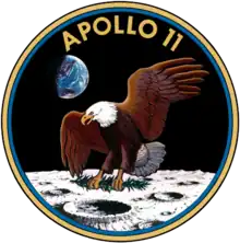 A logo depicting an eagle upon the surface of the moon