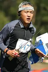 ARDF orienteer wearing a map board on his left arm