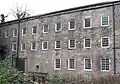 Existing three of five storeys showing the extent of the original mill. Initially there was an undershot waterwheel to the right outside of the picture.