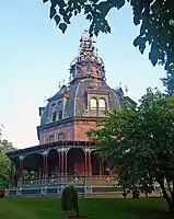 Large ornate house, with a level of decoration more usually associated with public buildings. Originally more modest in conception, the house was built in 1860 and the dome was added during 1872–1876. Armour–Stiner House, Irvington, New York.