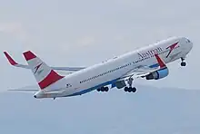 Rear quarter view of an Austrian Airlines 767, with red winglets