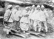 Austro-Hungarian ski patrol in two-part snow uniforms with improvised head camouflage on Italian front, 1915-1918