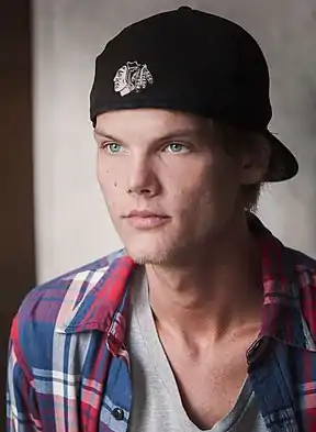 Black-and-white photo of Avicii smiling