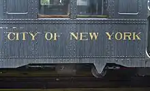 The side of an Arnine, an original IND subway car purchased by the BOT, bearing the name "City of New York".