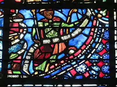 Window of Saint Joseph, Bay 9. (13th c.)  The glass is signed by the artist on the band in front of the Saint: "Clement- glassmaker of Chartres"