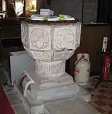 The 14th-century baptismal font