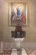 The baptismal font of Saint Bartholmew parish church in Marne, Italy.