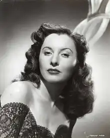 Portrait of Barbara Stanwyck by Whitey Schafer, October 1944. Her shining shoulders are likely the result of canned sex.