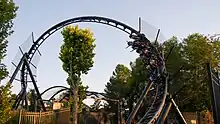 Photo of Batman Gotham City Escape, showing its first inversion, a counter-clockwise corkscrew leading into the roller coaster's second LSM launch.