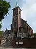 Het orgel en het oksaal, aangrenzende muren en het plafond van de eerste travee van de kerk Saint-Remy