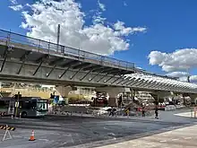 Concrete viaduct crossing street with construction site underneath