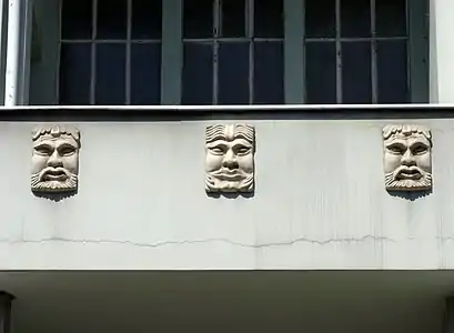 Mustached faces on the balcony