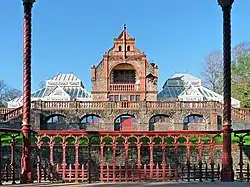 A photograph showing the 19th century Pavilion and Conservatories, surrounded by the green spaces of the Park