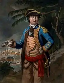 Arnold is shown wearing a military uniform: blue coat over buff waistcoat and trousers, red waistband, tricorner hat. In the background a town is visible, as are trees that look something like palm trees.