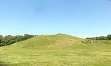 Two grass-covered mounds