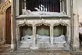 The cadaver tomb of Bishop Richard Fleming in Lincoln Cathedral. He is depicted as if alive at the top; the lower effigy shows his decaying corpse in a shroud (1431).