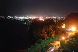 Skyline of Bislig City on night time showing the nearby Bislig Bay taken at the Ocean View Park in Barangay Comawas