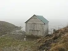 Boathouse, Loch Hoil This hut hasn't really slipped into the water, as it appears here. From the side it can be seen as standing on short posts.