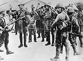 Troops of the Suffolk Regiment surrendering to the Japanese, 1942