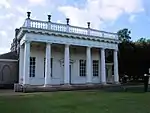 Bowling Green House and two urns on pedestals 5m to the south-east and north-east