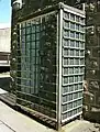 Safety cage around entrance to indoor hive (now dismantled)