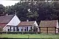 Old style farmhouse with barn