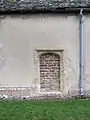 Small doorway, now blocked, in a church