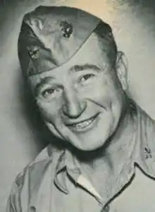 A headshot image of then Colonel William J. Fox smiling and facing the camera