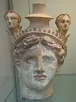 Female head incorporating a vase (lekythos), c. 325-300 BC.