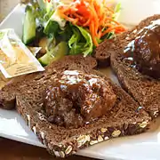 Broodje bal, a slice of bread with a meatball and gravy