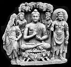 Gandhara Buddhist Triad from Sahr-i-Bahlol, c. 132 CE, similar to the dated Brussels Buddha. Peshawar Museum.