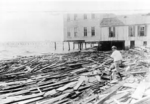 = A disheveled remains of a wooden building along the coast