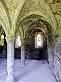 View of the chapter house, showing the three remaining windows in the east wall.