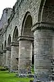 Arches on the north side of the nave, featuring round-sectioned columns with scalloped capitals.