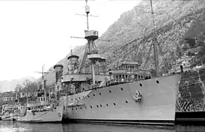 a photograph of ships docked alongside each other at a wharf