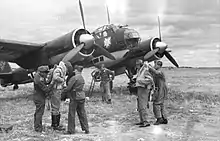 Nazi-era photo with KG 51 insignia on a Ju 88 bomber.