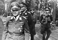 A photo of paratroop commander Kurt Studentfollowed by Hermann-Bernhard Ramcke and Hans Kroh in 1941