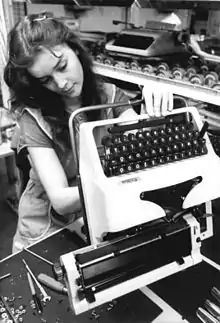 One of 17,000 assembly workers at Robotron in 1987 is working at weekend to make typewriters.