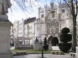 An ornate stone gate with statues.