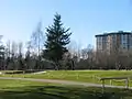 Burnaby Mountain Golf Course surrounds Squint Lake. Montecito Towers in the background