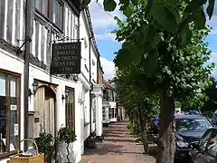 Chateaubriand, Premises occupied by E Watson and Sons,  E Workman Greengrocers and Villiers, High St