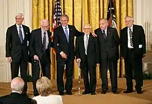 President George W. Bush presents the 2007 National Humanities Medal for the Monuments Men Foundation for the Preservation of Art to, from left, Robert Edsel and World War II veterans Jim Reeds, Seymour Pomrenze, Harry L. Ettlinger, and Horace Apgar.