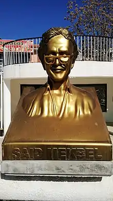 golden-hued bust of Saïd Mekbel