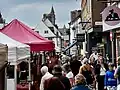 Shoppers and stalls on Market Place in St Albans Market.