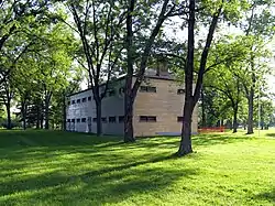 A view of Butler's Barracks among a grove of trees