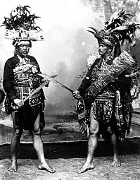 Minahasan men with ancient war equipment.