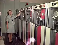 PFC Patricia Barbeau operates a tape-drive on the IBM 729 at Camp Smith.