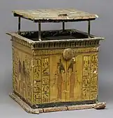 Yellow box painted with goddesses and text