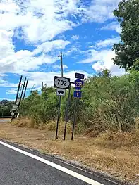 PR-238 at its junction with PR-702 in Palmarejo barrio