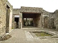 Photograph of a ruined house in Pompeii.